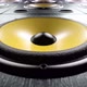 Moving over Audio Speakers with Yellow Membranes Playing Rhythmic Music - VideoHive Item for Sale