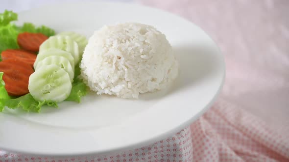 Rice and vegetables on a white plate