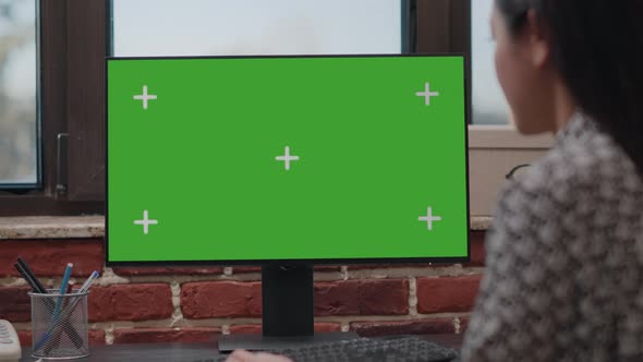 Close Up of Worker Using Computer with Horizontal Green Screen