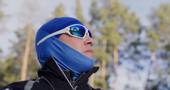 Male Skier in Blue Mirrored Goggles and Balaclava