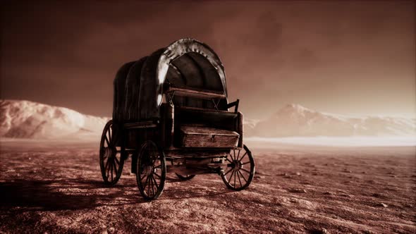 Canvas Covered Retro Wagon in Desert at Sunset alt