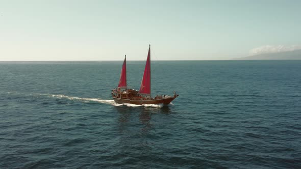 Vintage Sailing Ship with Crimson Sails Sails for Romantic Adventures