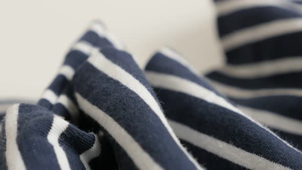 Blue and white striped fabric sample close-up 4K 2160p 30fps UltraHD footage - Gathers of sailor mar