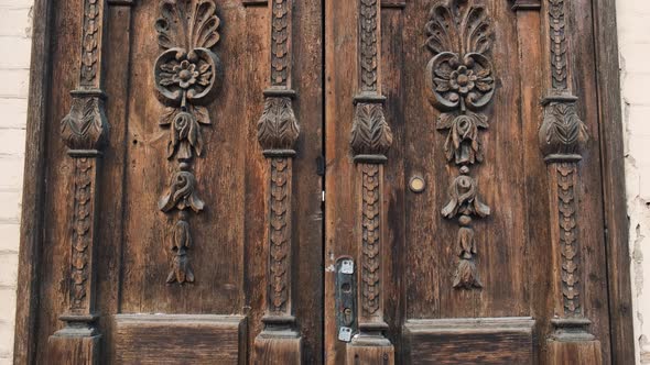 An Old Wooden Door in To a Beautiful Ancient Place Tilt-up Shot. Wood Texture Doors