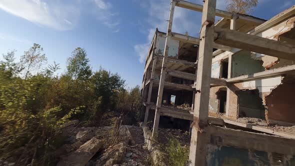 FPV Drone Flies Quickly and Maneuverable Among Abandoned Industrial Buildings and Around an