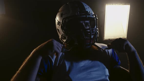 American Football Championship Game Close Up Portrait of Professional Player Removing on Helmet