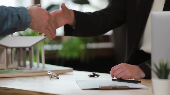 Man Sign Mortgage Contract, Put Signature on Sale Purchase Rental Agreement, Handshaking Realtor