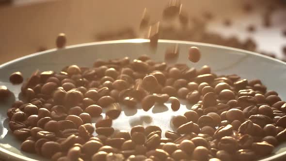 Brown Roasted Coffee Beans Falling on Pile