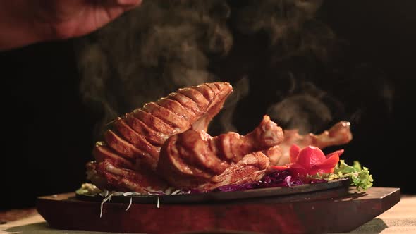 Close Up Of  Roasted Chicken Bbq With Salt Sprinkle Black Background