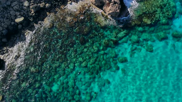 Aerial View of Crystal Clear Blue Water in Quiet Lagoon on Shore of Cyprus