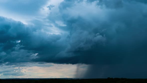 Timelapse Gray Rainy Clouds Float Across the Dark Sky on a Cloudy Day