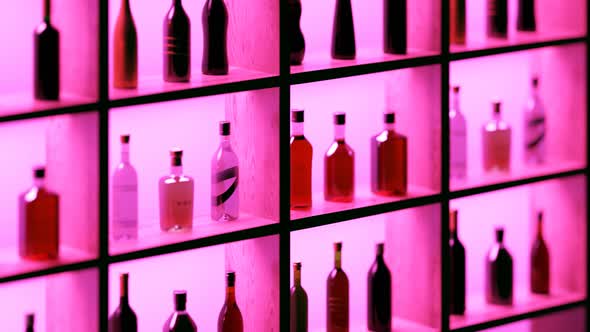 Bar shelf with bottles of different liquors. Alcohols collection. Loopable. 4KHD