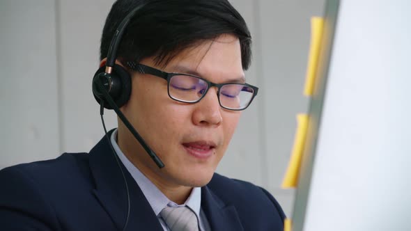 Business People Wearing Headset Working in Office