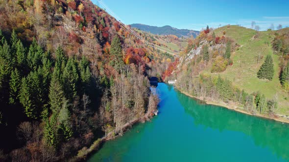 Drone Flight Over Klammsee Reservoir In Autumn Under Blue Sky