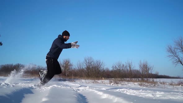 Guy Runs in Snow and Does Cool Trick Somersaults in Snowdrift