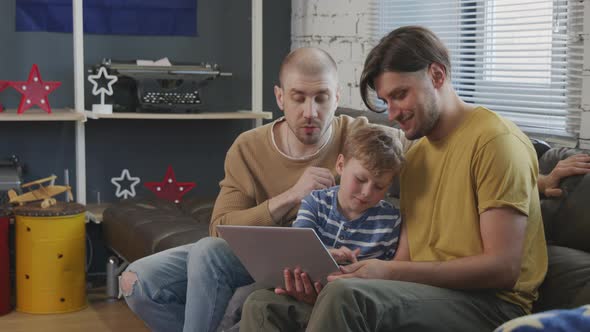 Happy Gay Couple and Kid Talking on Video Call