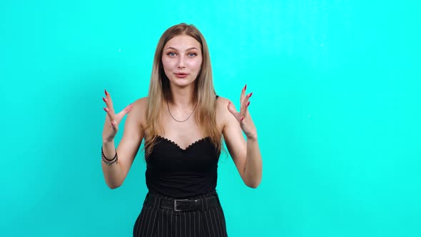 Upset Teenager, Dissatisfied. Charming Girl, Dressed in Black T-shirt with Cleavage