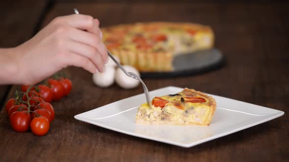 Chicken Quiche Lorraine with Mushrooms, Tomatoes and Cheese. French Cuisine