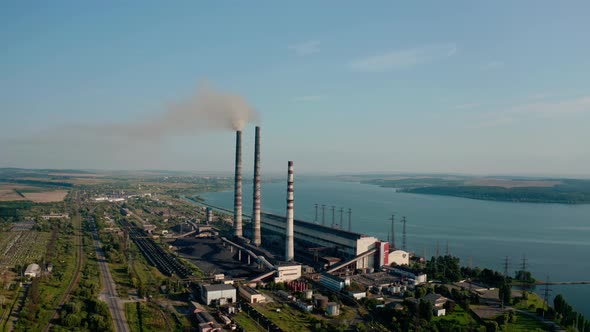 Aerial Drone View of High Chimney Pipes with Grey Smoke From Coal Power Plant, Wide View