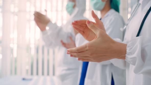 Close up Group of Asian doctor and nurse clapping the hands with smile.