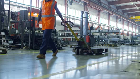 Young Female Technician Walking with Cart