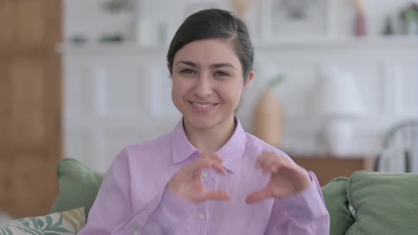 Portrait of Indian Woman Making Heart Shape with Hands