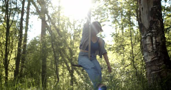 Girl Swings on a Bungee Against the Sun Happiness and Joy