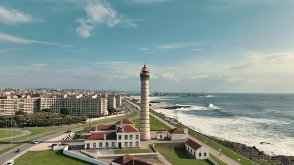 Aerial view over the lighthouse of  Leça da Palmeira, Matosinhos with the city and coastline behind.