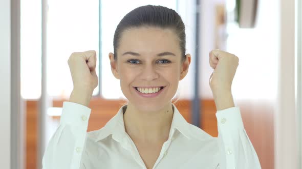 Woman Indoor Celebrating Success