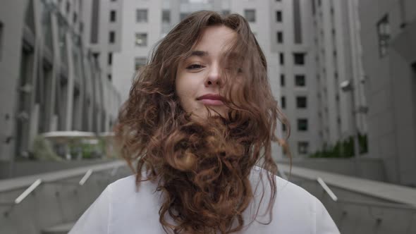 Face Of Young Girl On City Street