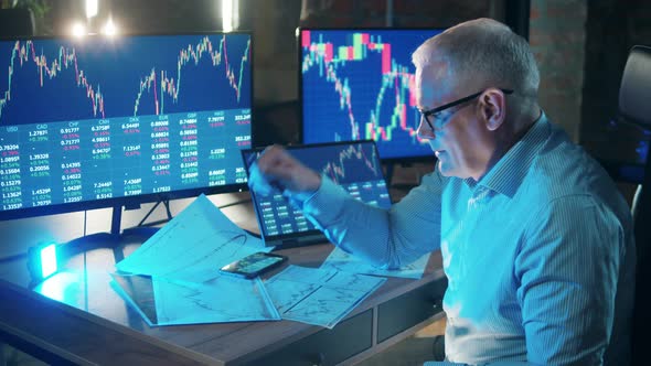 Male Trader is Getting Exhausted While Monitoring Stock Data