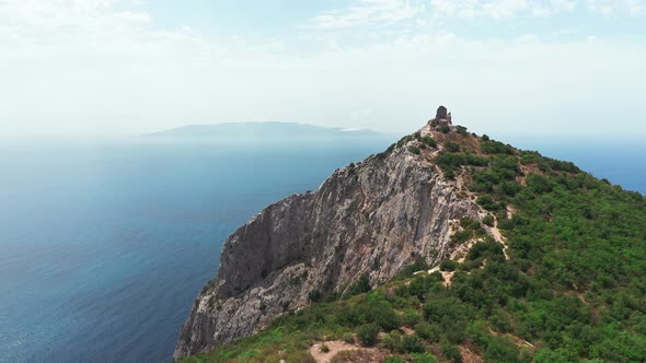 Aerial View of Ancient and Medieval Building on the Top of Mountainrocky Coastline with Green