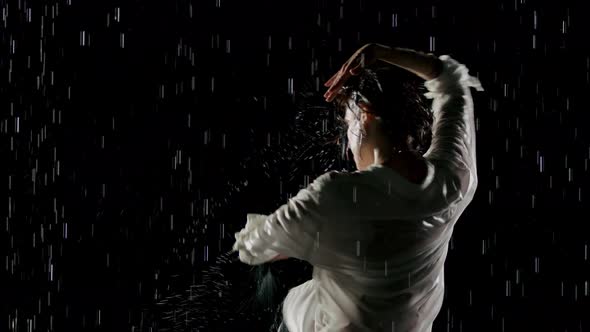 Beautiful Woman Dancing In The Rain