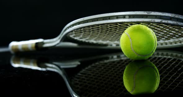 Tennis ball and racket in studio 4k