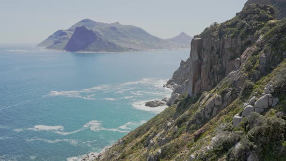 Chapman's Peak Dirve, with a view of Hout Bay, Cape Town, SOuth Africa. Extreme wide, static shot.