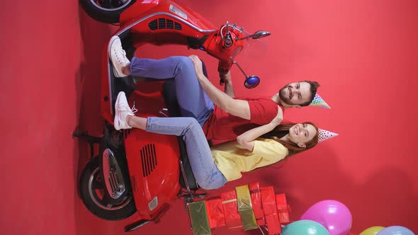 Cheerful Young Couple Man Woman Scooter Deliver Balloons Gifts Holiday Birthday