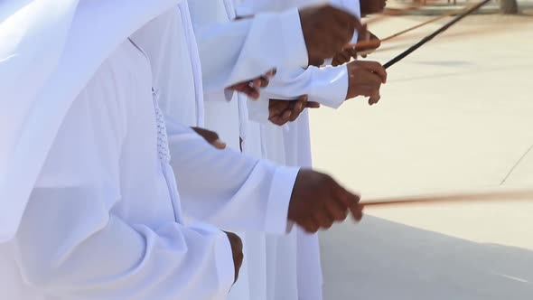 Traditional Emirati Male Dance UAE Heritage Hands in Frame