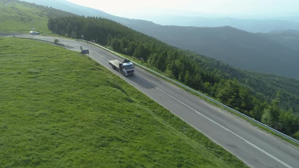 Drone Follows Large Transportation Truck Down a Mountain Road