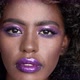 Close Up Portrait of Beautiful African Female Model with Afro Hair and Glowing Purple Makeup - VideoHive Item for Sale