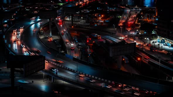 Modern Night City with Cars Buildings Street Lamps