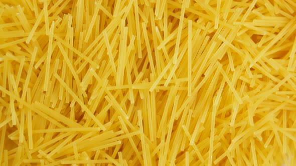 Spaghetti - yellow pasta, ready for cooking.