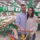 Attractive happy millennial couple shopping in supermarket with shopping cart - VideoHive Item for Sale