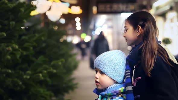 Happy Kids at Christmas Time Outdoor in a City