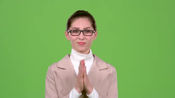 Businessman Crosses His Fingers, She Hopes To Win. Green Screen. Slow Motion