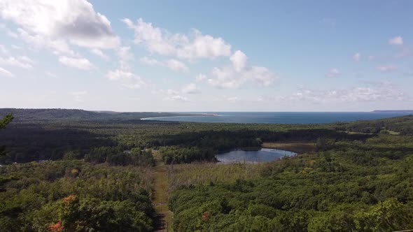 Green Landscape Surrounded Glen Lake With Sleeping Bear Dunes National Lakeshore At Background Near