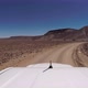 Car Driving on Gravel Road in Desert - VideoHive Item for Sale