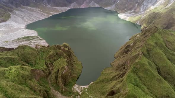 Aerial view of volcanic Lake Pinatubo and mountains, Porac, Philippines.