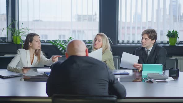 Group of People Discussing Business Project Idea Sitting in Office As Man Entering