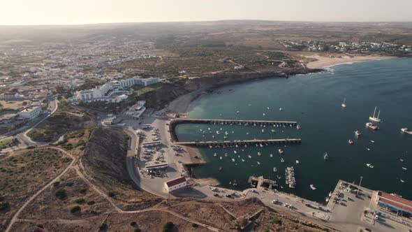 Rotating aerial of the port of Sagres, Portugal during golden hour