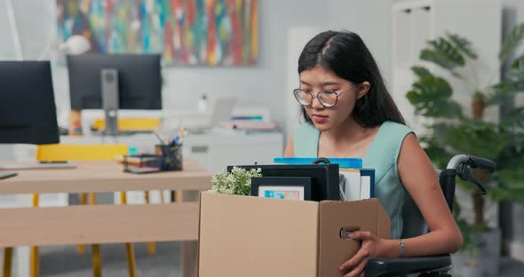 Sad Disillusioned Disappointed Young Woman with Glasses with Sorrow Leaves Her Job in the Company